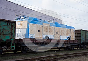 New trolleybus being shipped on rails. Special freight train carrying trolley-buses built.