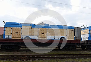 New trolleybus being shipped on rails. Special freight train carrying trolley-buses built. Logistics of passenger rail transport