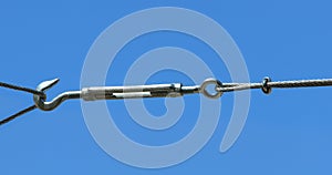 A new turnbuckle with eye bolt and hook bolt on blue sky background