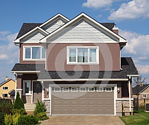 New two-storied brick cottage with garage