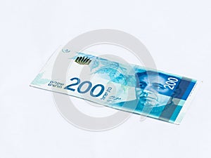 A new type of banknote worth 200 Israeli shekels isolated on a white background