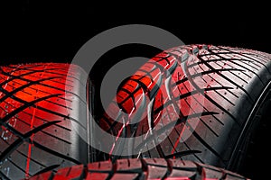 New tyres background. Car tyres close up