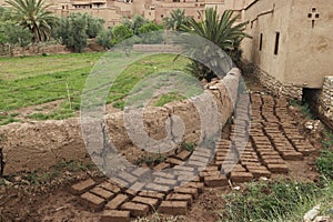 New, unlaid mudbricks in ancient desert city Ait Benhaddou, Morocco.