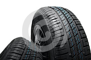 New and unused car tires against isolated background