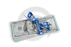 New US one hundred dollar banknote tied with blue christmas ribbon