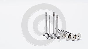 New valves for the car engine on a white background.