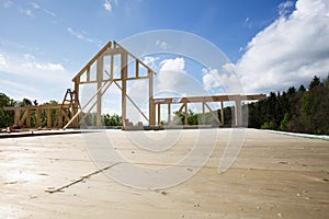 New wall of wooden house under construction