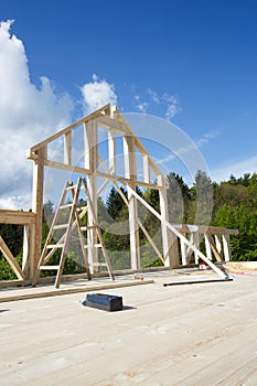 New wall of wooden house under construction