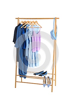 New wardrobe rack with stylish lady`s clothes and shoes
