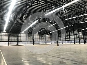 New warehouse for your business, Big Room for Product stock. Lighting on empty warehouse