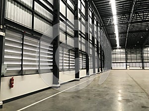 New warehouse for your business, Big Room for Product stock. Lighting on empty warehouse