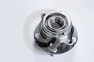 New Wheel hub assembly with bearing. This is part of the car suspension on a gray background with a gradient. The