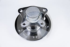 New Wheel hub assembly with bearing. This is part of the car suspension on a gray background with a gradient. The