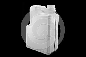 New white plastic oil canister isolated on black background. Storage tank. Canister for gasoline, diesel and gas. White plastic