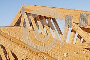 New wood pine trusses with metal joist hangers attached