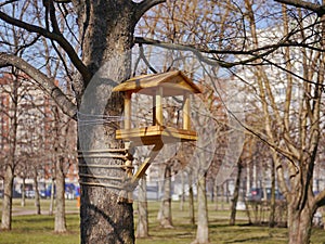 A new wooden bird house on the tree