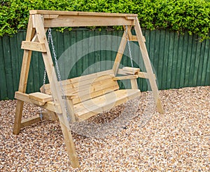 New wooden garden swing bench