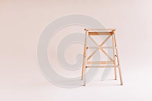 New wooden ladder on the white background. isolated stepladder. Space for text