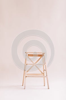 New wooden ladder on the white background. isolated stepladder. Space for text