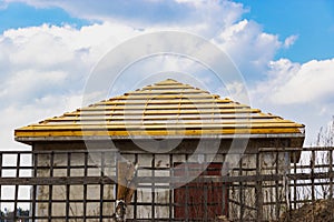 New wooden roof on an old building. Roof repair. Rafter system of the house
