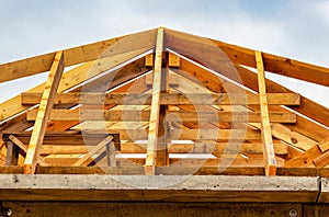 New wooden roof on an old building. Roof repair. Rafter system of the house