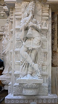 New work in old style workmanship on pillar in Jain temple India