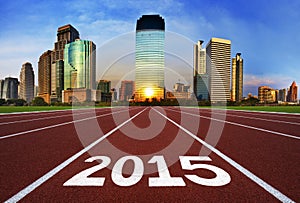 New Year 2015 on running track concept with modern city.