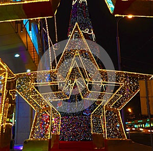 New Year 2018 and Christmas New Year`s decoration of a street in the form of a tunnel of stars in Moscow