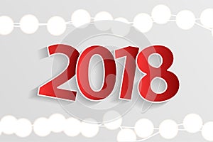 New Year 2018 concept with paper cuted white numbers on realistic Christmas lights decorations on white background