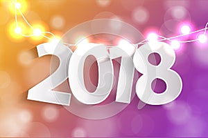 New Year 2018 concept with paper cuted white numbers on realistic Christmas lights decorations on yellow and violet background