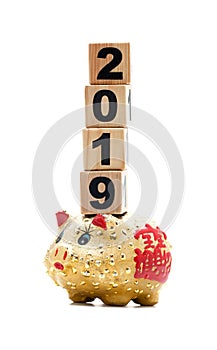 New Year 2019: piggy bank and building blocks