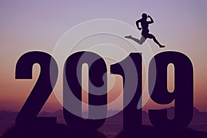 New year 2019 silhouette with jumping man as symbol for changes