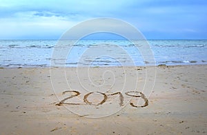 New Year 2019 written on the beach sand