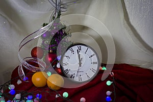 New Year 2020. Christmas decoration clock and toys on a dark background with lights. Background for design