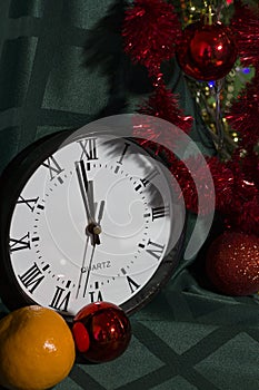 New Year 2020. Christmas decoration clock and toys on a dark background with lights. Background for design