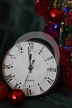 New Year 2020. Christmas decoration clock and toys on a dark background with lights. Background for design