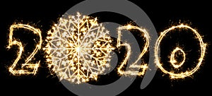 New Year 2020 with snowflake made by sparkler . Number 2020 and sign written sparkling sparklers . Isolated on a black background