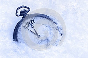 New Year 2021 greeting card, 2021 new year, pocket watch in snow, happy new year concept