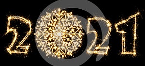 New Year 2021 with snowflake made by sparkler . Number 2021 and sign written sparkling sparklers . Isolated on a black background