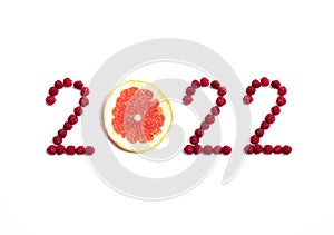 New year 2022 made of fruit and berries on the white background.