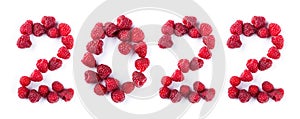 New year 2022 made of raspberries on the white background. Healthy food
