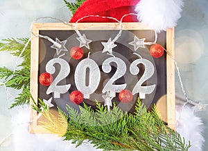 New year 2022 numbers on blackboard with star shape lights