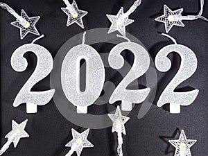 New year 2022 numbers on blackboard with star shape lights