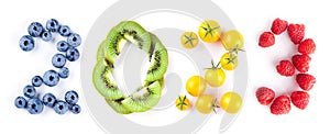 New year 2023 made of fruits on the white background.