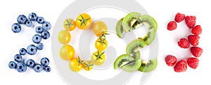 New year 2023 made of fruits on the white background. Healthy food