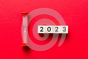 New Year 2023 sand timer. Resolution, time, plan, goal, motivation, reboot, countdown and New Year holiday concepts