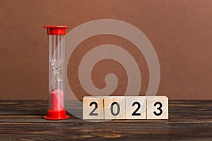 New Year 2023 sand timer. Resolution, time, plan, goal, motivation, reboot, countdown and New Year holiday concepts