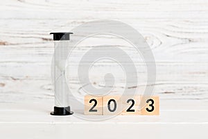 New Year 2023 sand timer. Resolution, time, plan, goal, motivation, reboot, countdown and New Year holiday concepts