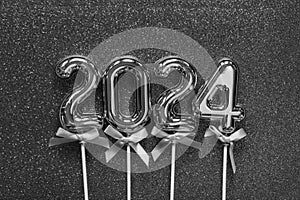 New Year 2024 - Old silver numbers on on glitter silver dust background