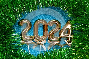 New Year 2024 - Orange old gold numbers on on glitter background